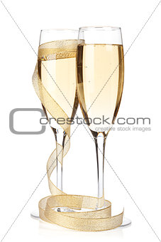 Champagne glasses with golden ribbon