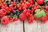 Fresh ripe berries on wooden table
