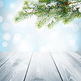 Christmas winter background with snow fir tree and wooden table