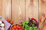 Fresh farmers tomatoes and basil on wood table