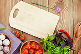 Fresh farmers tomatoes and basil on wood table