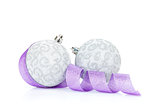 Christmas baubles and purple ribbon