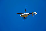 TV news helicopter on a blue sky