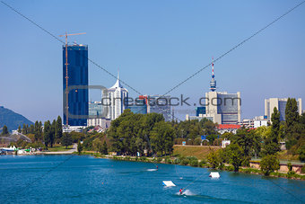 Waterskiing in Vienna with modern city skyline on background