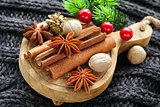 spices anise, cinnamon, nutmeg on warm knitted background