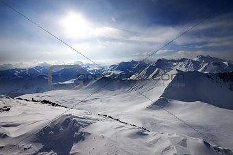Snowy mountains and view on off-piste slope