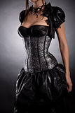 Young woman wearing silver corset with stars 