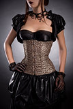 Beautiful young woman in Victorian style outfit and rose corset 