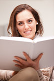 beautiful fascinating woman reading a book