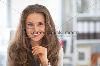 Portrait of happy business woman in modern office