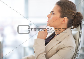 Portrait of thoughtful business woman in office