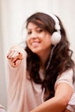girl pointing her finger while listening music