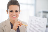 Portrait of happy business woman showing agreement