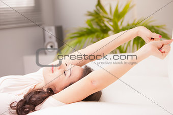 girl stretching and yawning in the morning