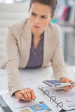 Closeup on business woman working with documents in office