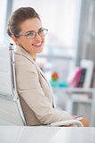 Portrait of happy business woman with eyeglasses in office