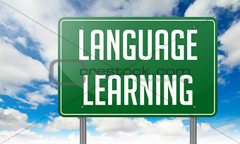 Language Learning on Green Highway Signpost.