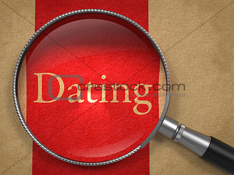 Dating - Magnifying Glass on Old Paper.