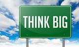 Think Big on Green Highway Signpost.