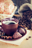 Cup coffee with beans and chocolate candies