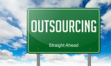 Outsourcing on Green Highway Signpost.