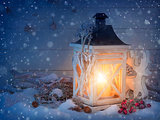 Burning lantern and christmas decoration 