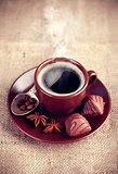 Cup hot coffee with chocolate sweets