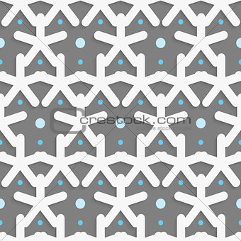White shapes with blue dots on dark gray pattern