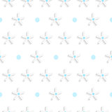 White small snowflake shapes with blue dots on white pattern