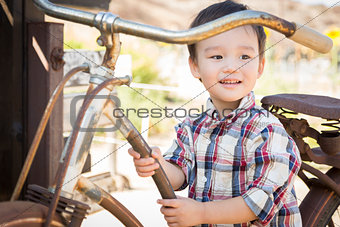 Mixed Race Young Boy Having Fun on the Bicycle