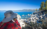 Woman Looking Over Beautiful Shoreline of Lake Tahoe.