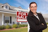 Young Woman in Front of House and Sale Sign