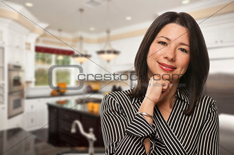 Hispanic Woman Standing in Beautiful Custom Kitchen