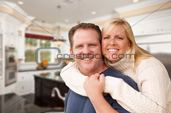 Happy Couple Inside Beautiful Custom Kitchen