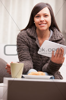 young businesswoman having a working breakfast