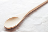 Wooden spoon on baking paper