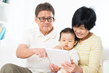 Asian family using tablet pc