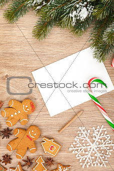 Christmas fir tree, gingerbread cookies and card for copy space