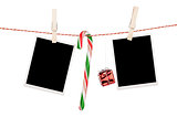Blank photo frames and candy cane hanging on the clothesline