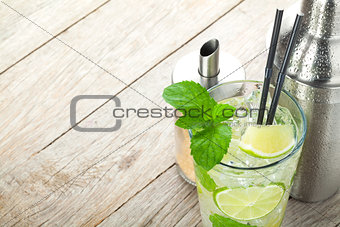 Fresh mojito cocktail and bar utensils