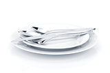 Silverware or flatware set over plates