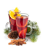 Christmas mulled wine with spices and snowy fir tree