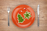 Christmas decor on plate and silverware