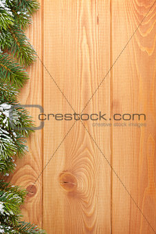 Wood texture with snow firtree christmas background