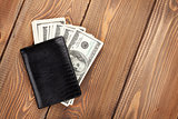 Money cash wallet on wooden table