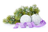 Christmas baubles and purple ribbon with snow fir tree