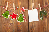 Snow fir tree, photo frame and christmas decor on rope