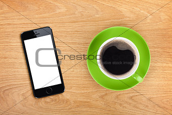 Mobile phone and coffee cup