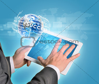 Man hands using tablet pc. Earth and business words near computer