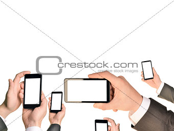 Mans hands using smart phones